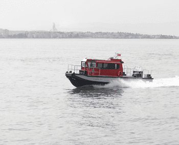 Versatile Plast Boat HDPE workboat designed for heavy-duty harbor logistics and crew transport, featuring a rugged construction and superior buoyancy.