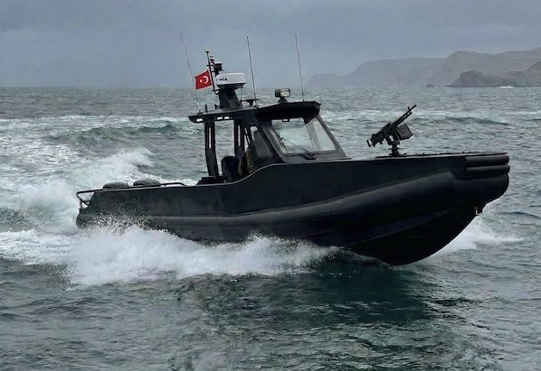 PlastBoat HDPE interceptor boat with weapon mount and radar systems, operating at high speed in rough coastal waters